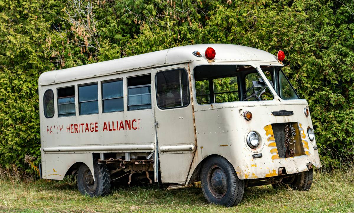 a dilapidated bus waiting for refurbishing